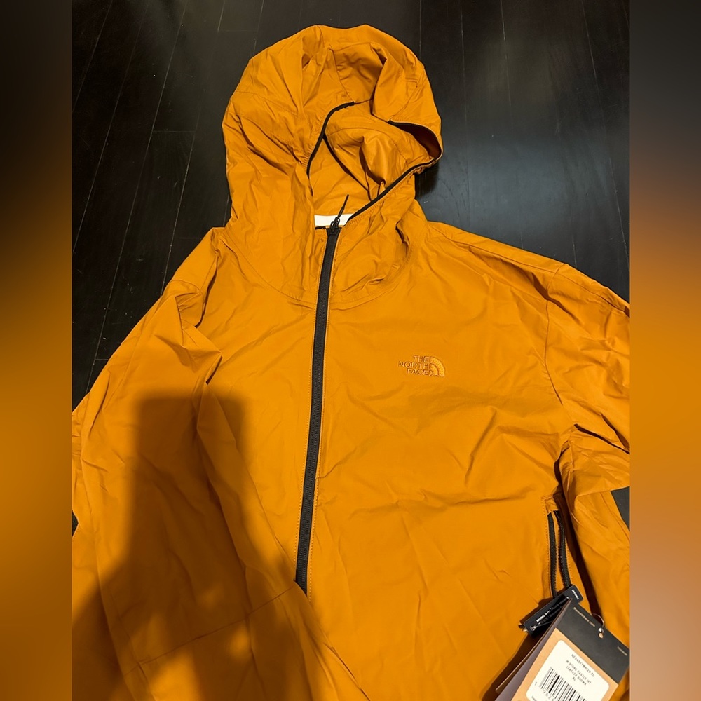 Brand new lightweight jacket with tags.